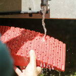 Redfoot Levelling - A person is holding the Redfoot Levelling Camper Levellers.