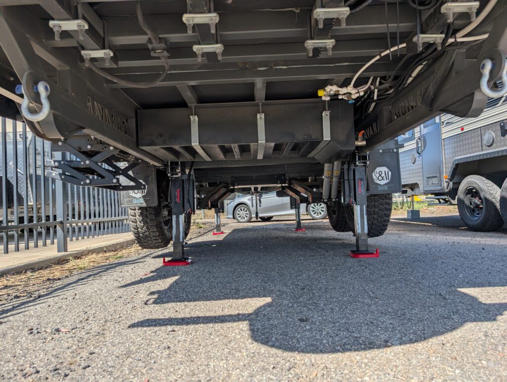 Front view of caravan being raised off ground by AutoLift system