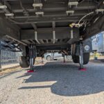 Front view of caravan being raised off ground by AutoLift system