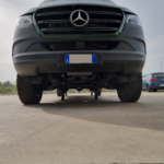 Front bumper shot with hydraulic jacks extended on mercedes sprinter van
